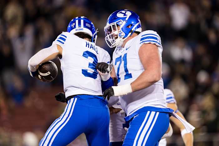 Nov 26, 2022; Stanford, California, USA; Brigham Young Cougars quarterback Jaren Hall (3) celebrates with offensive lineman Blake Freeland (71) after scoring a touchdown against the Stanford Cardinal during the first half at Stanford Stadium. Mandatory Credit: John Hefti-USA TODAY Sports